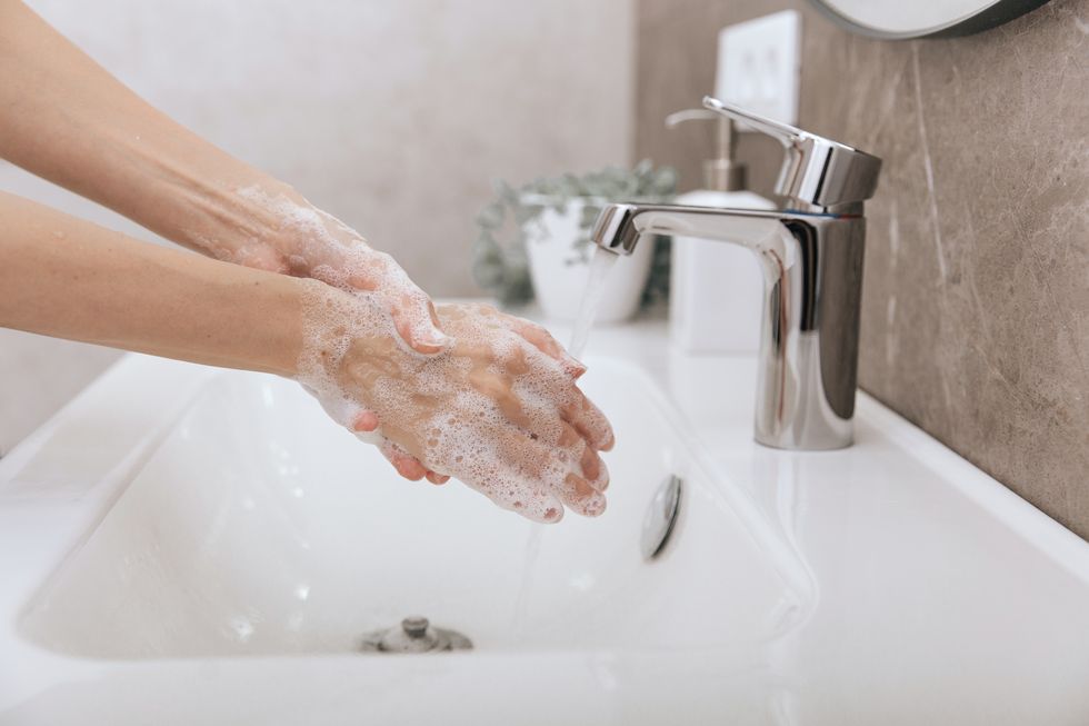 washing-hands-under-the-flowing-water-tap-hygiene-royalty-free-image-1693464977.jpg