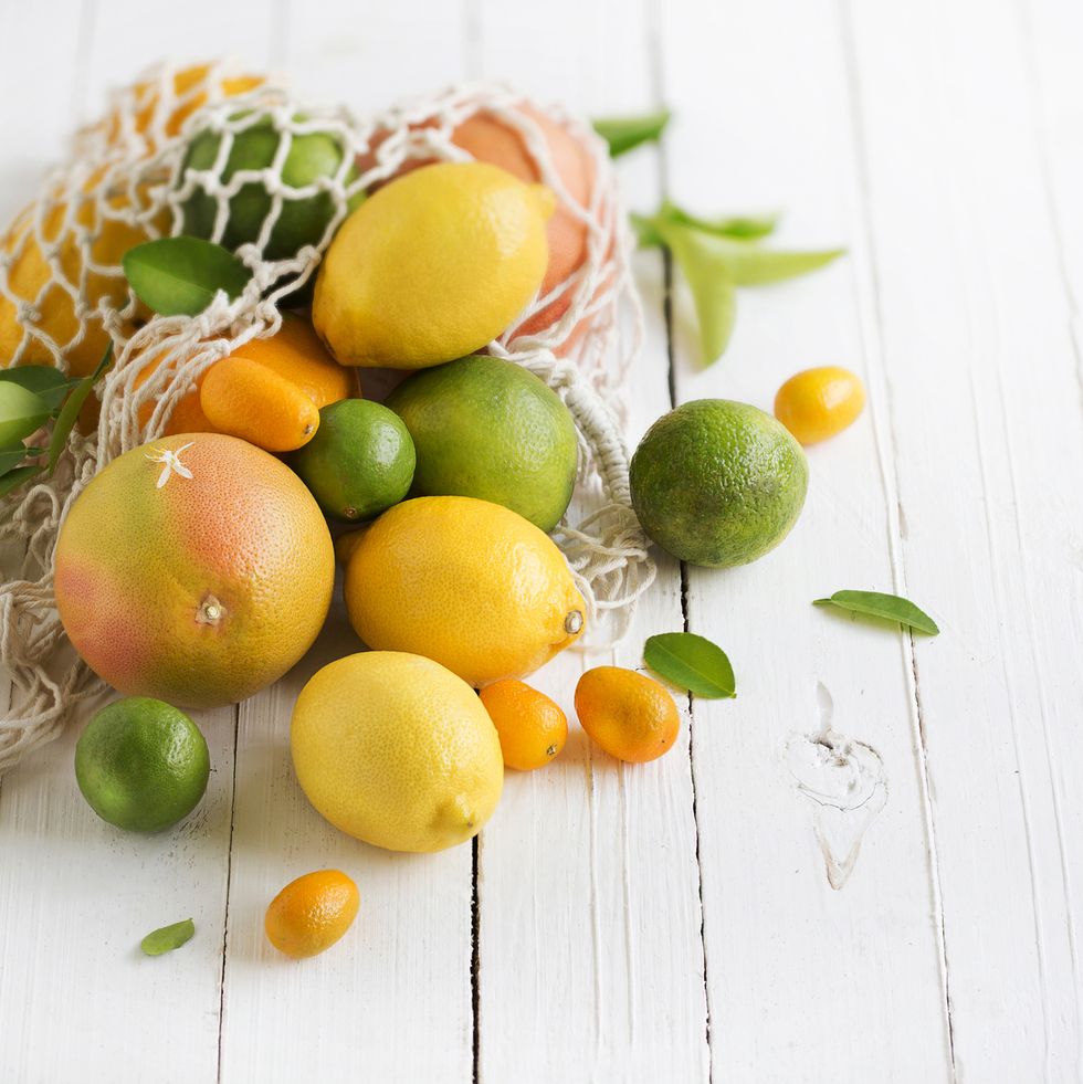 citrus-fruits-family-on-rustic-white-wooden-royalty-free-image-1642146827.jpg